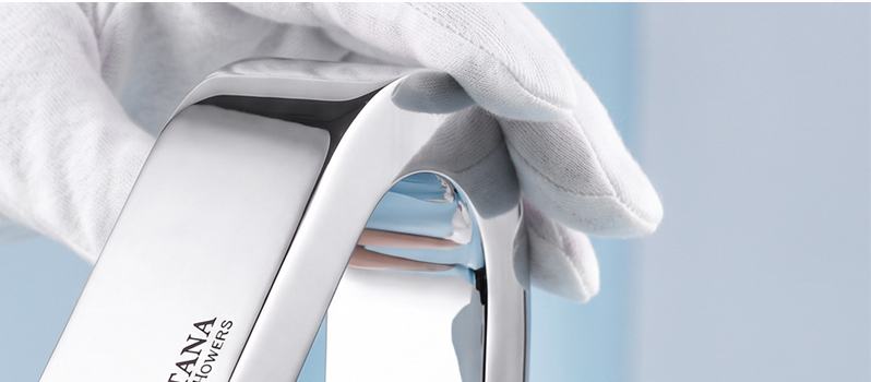 A gloved specialist inspecting a Fontana touchless faucet