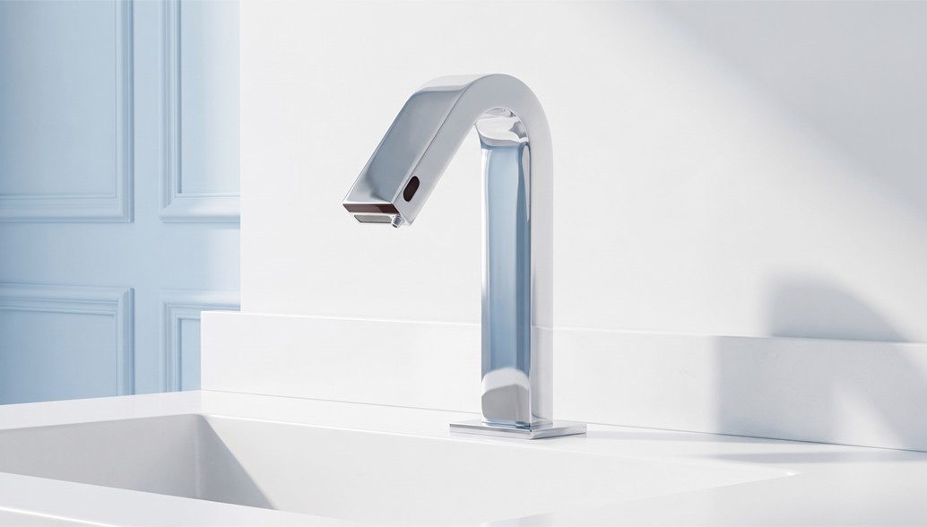 Chrome touchless faucet in a bright bathroom