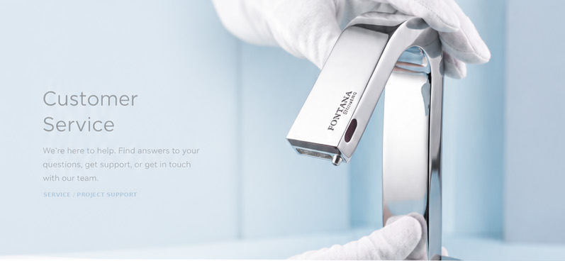 A gloved specialist inspecting a Fontana touchless faucet