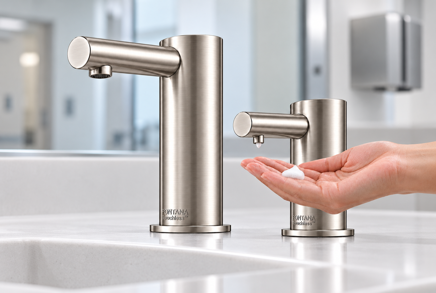 Chrome touchless faucet bank in an architectural commercial restroom
