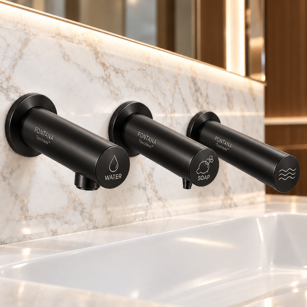 Matte black touchless water fixture in a coordinated commercial restroom system