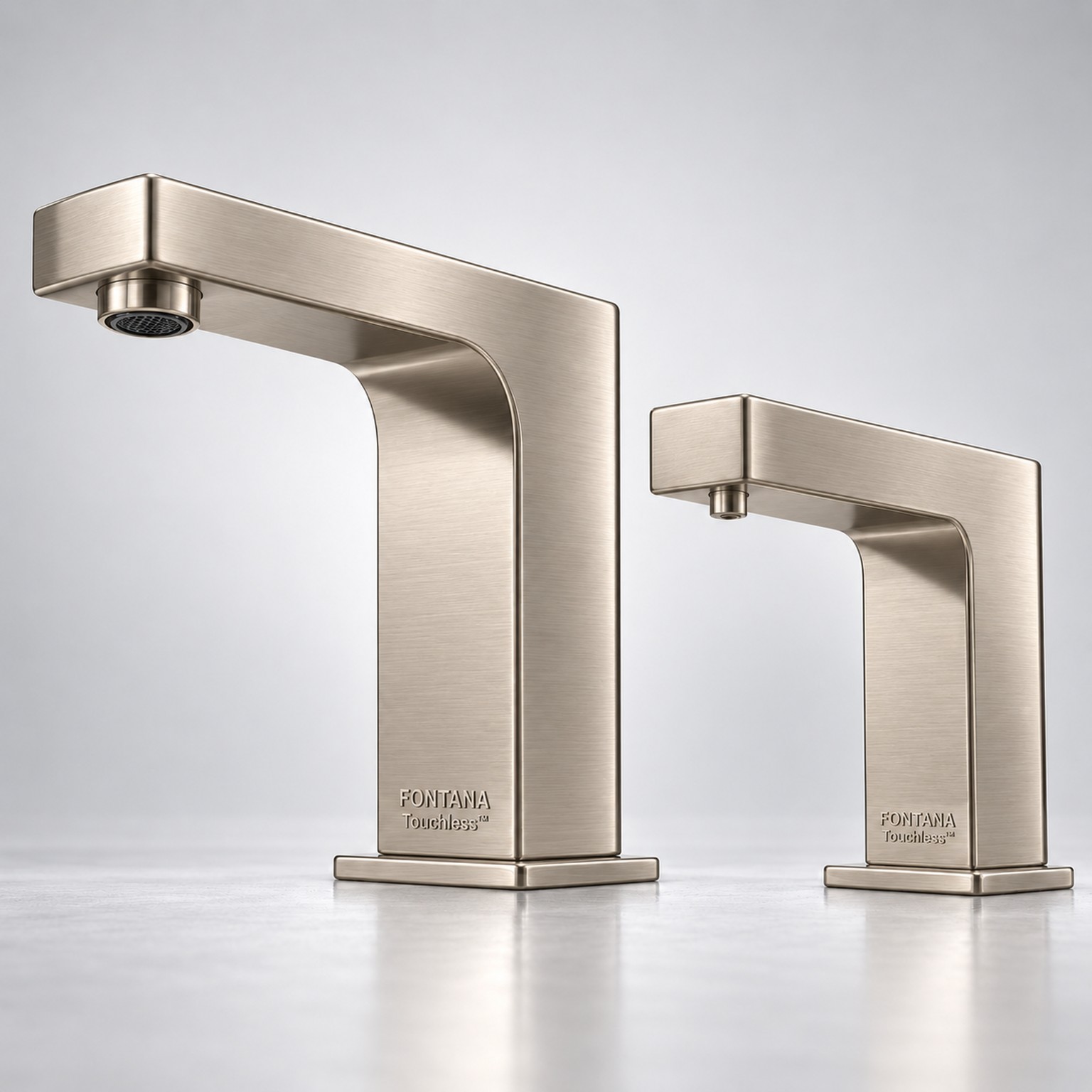 Stainless steel finish touchless soap dispenser and faucet in a contemporary bathroom