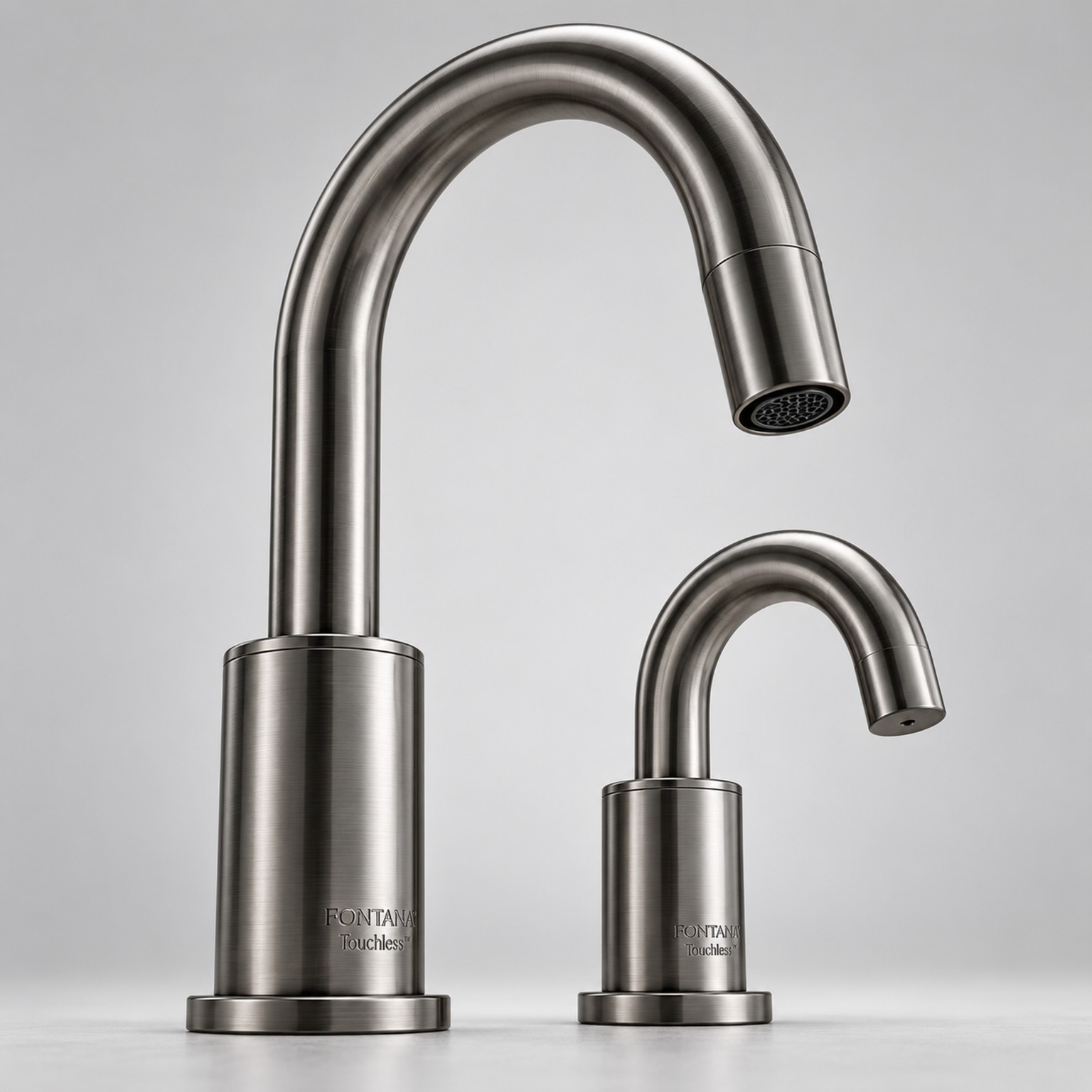 Polished chrome tapered touchless faucet and matching soap dispenser in office restroom