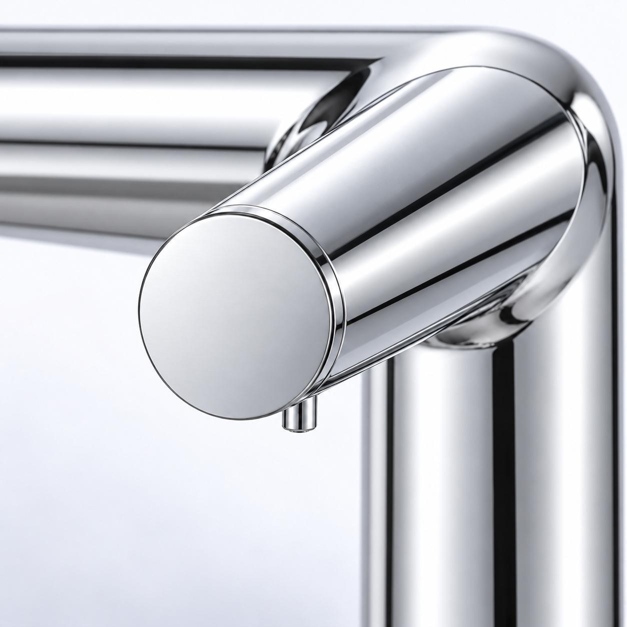 Close-up of chrome touchless faucet spout and cylindrical end-cap detail