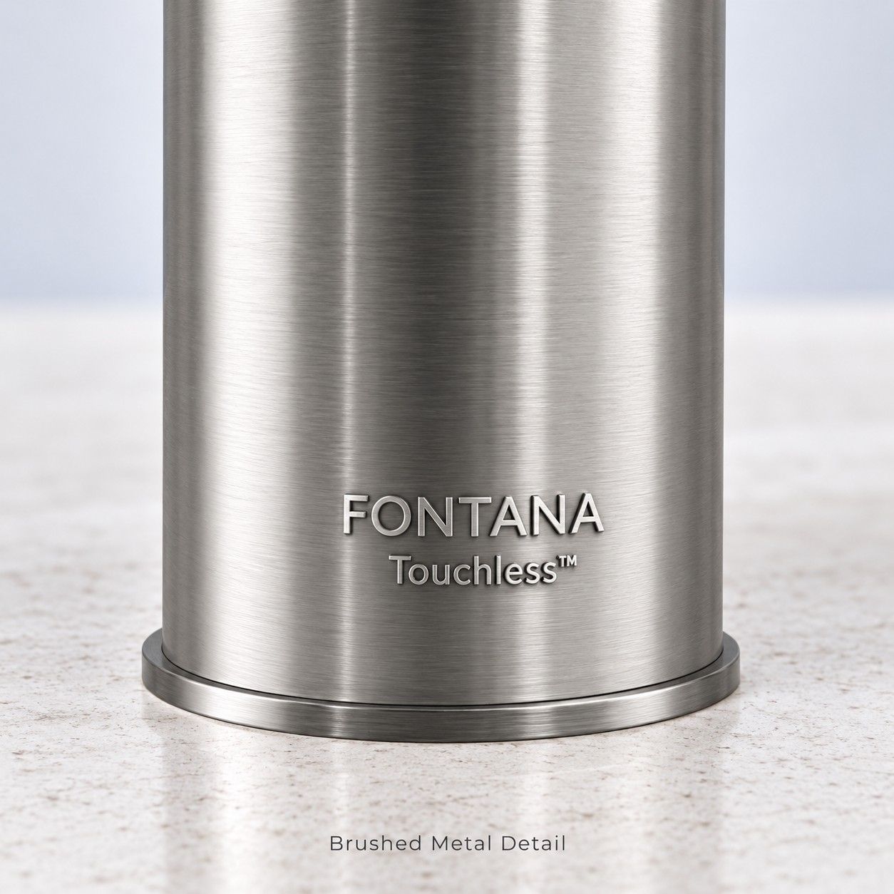 Brushed nickel touchless faucet and integrated hand dryer close-up showing fixture details