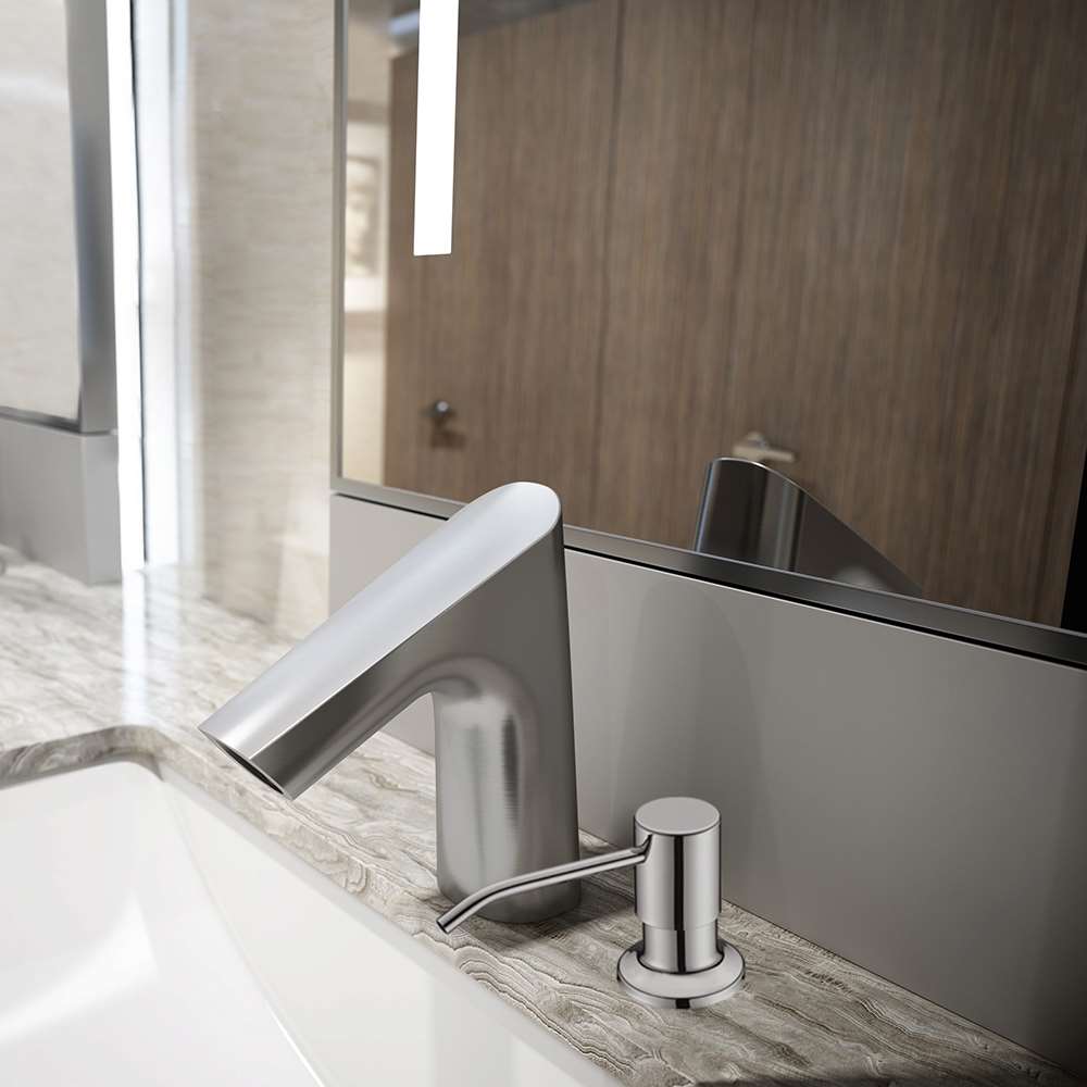 Chrome deck-mounted sensor faucet and soap dispenser installed at a marble basin